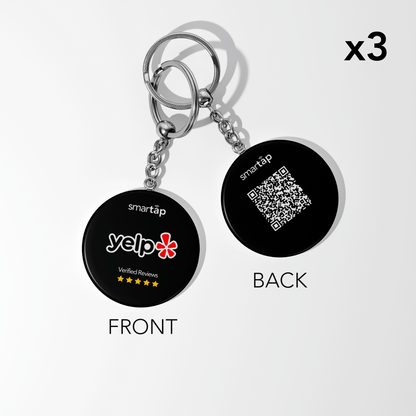 Set of three Yelp keychains with customizable NFC chip and QR code, black round PVC design showing Yelp logo and 5-star reviews on front and QR code on back.